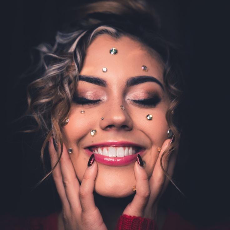 Aanya Rao, Lead Design Curator at PlainPulseFrame, reviewing corporate floral arrangements